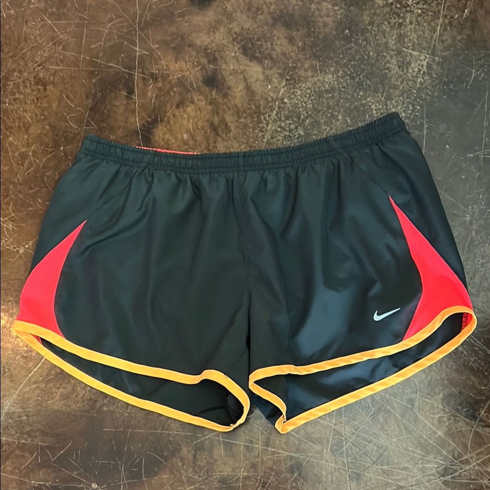 Women’s Nike running shorts black with orange. Size Large
